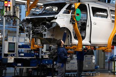 HANOVER, GERMANY - MARCH 4: A worker assembles a VW ID. Buzz electric van at the Volkswagen commercial vehicles van and bus factory on March 4, 2026 in Hanover, Germany. Volkswagen, Germany's biggest car maker, is scheduled to announce financial results on March 10. (Photo by Christian Ender/Getty Images)